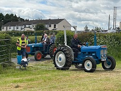 Vintage Tractors coming into field for Tamlaght O'Crilly Parish Vintage Rally 2023